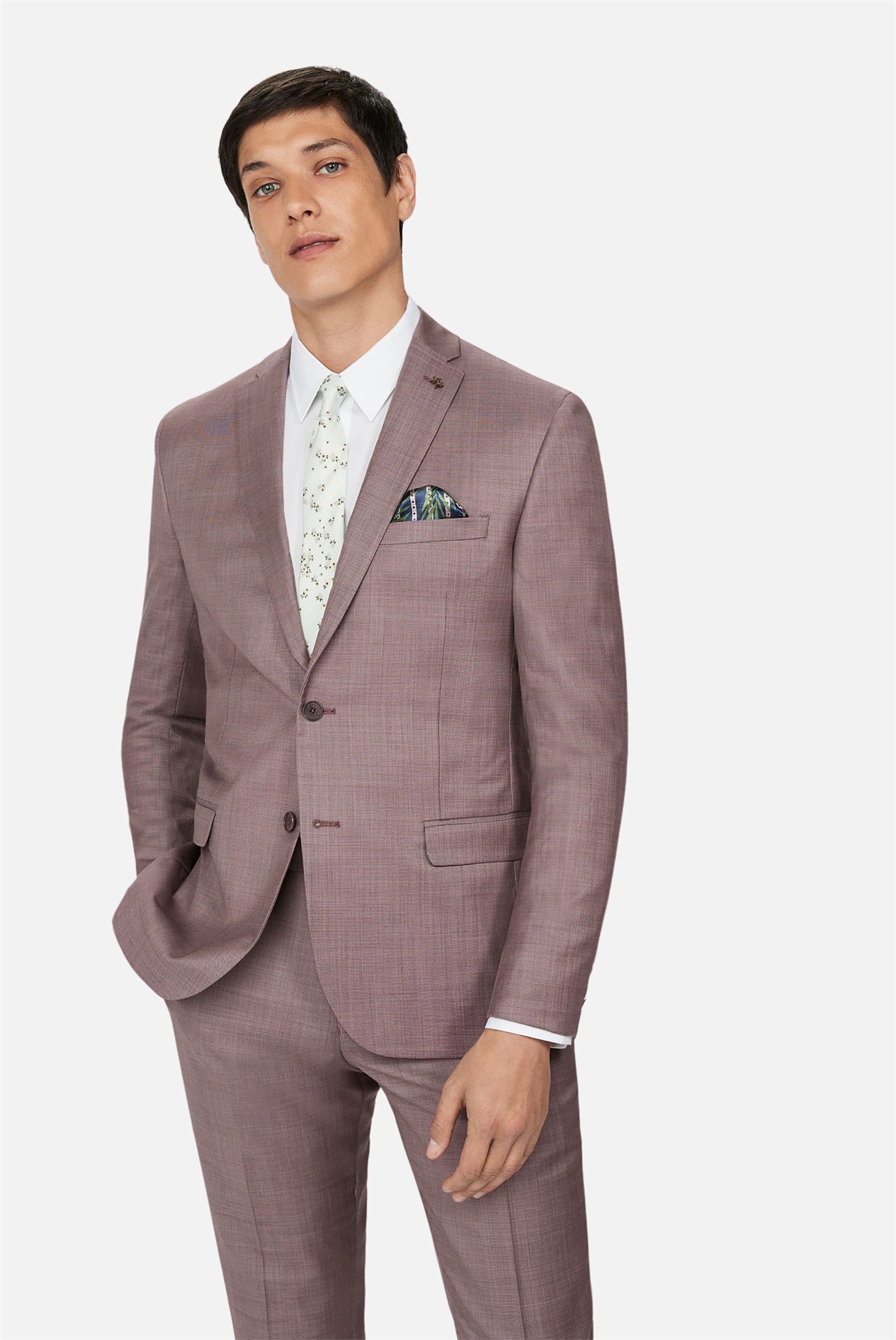 Man wearing a Ted Baker dusky pink slim fit suit jacket.