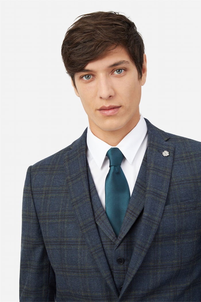 Head shot of a man wearing a Ted Baker suit jacket.