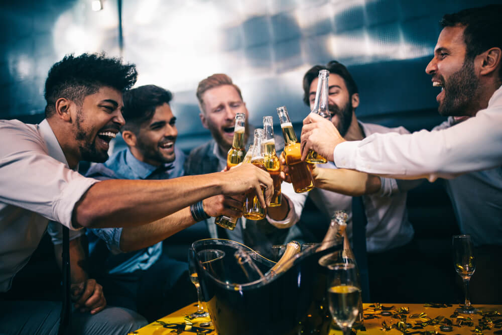 men drinking in a nightclub