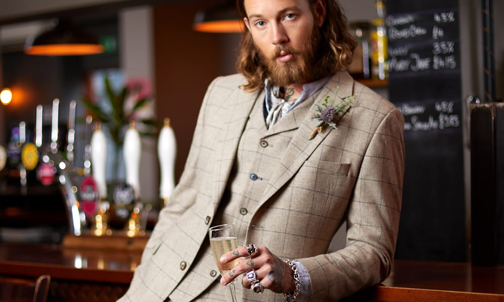 Is a beige suit appropriate for a wedding?