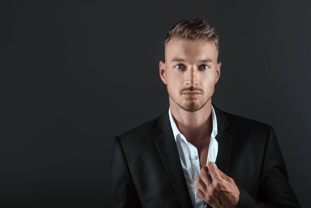 man wearing a suit with a white shirt