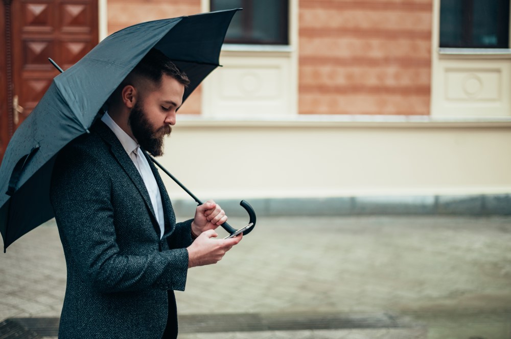 Man wearing suit in rain