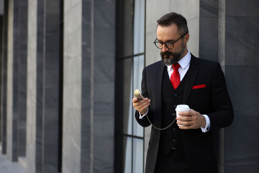 man wearing a pocket watch with a waistcoat