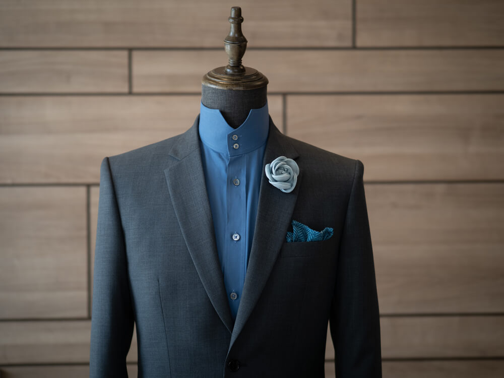 blue shirt with grey suit