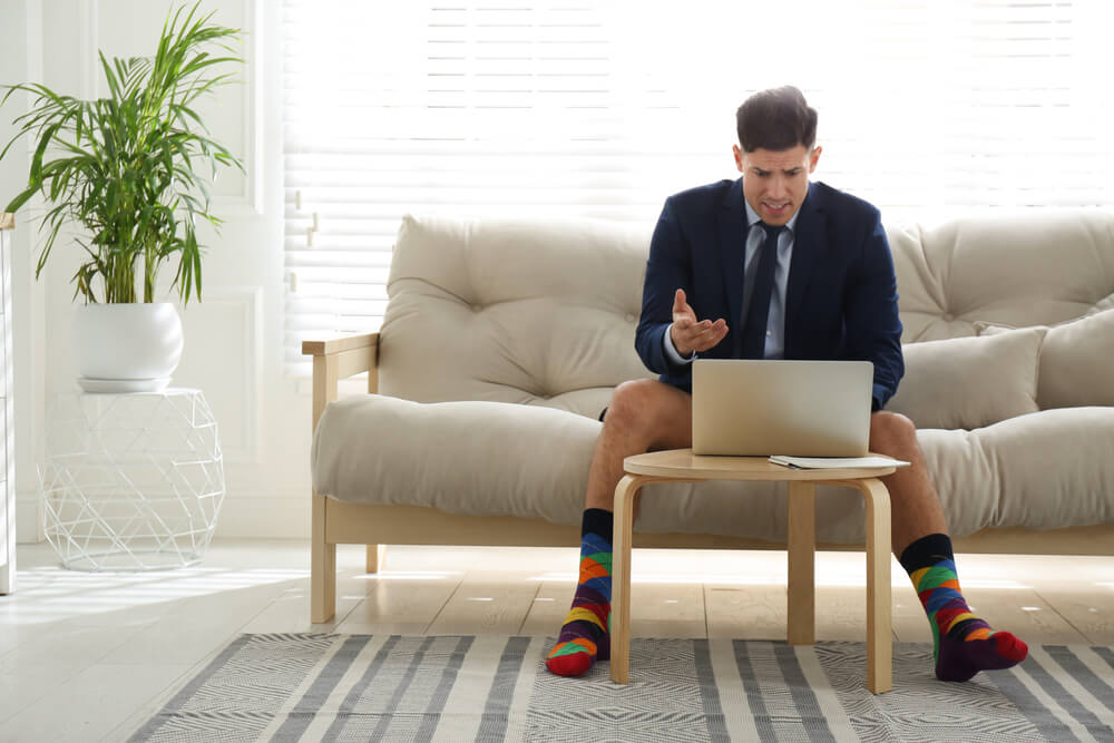 man in suit working from home