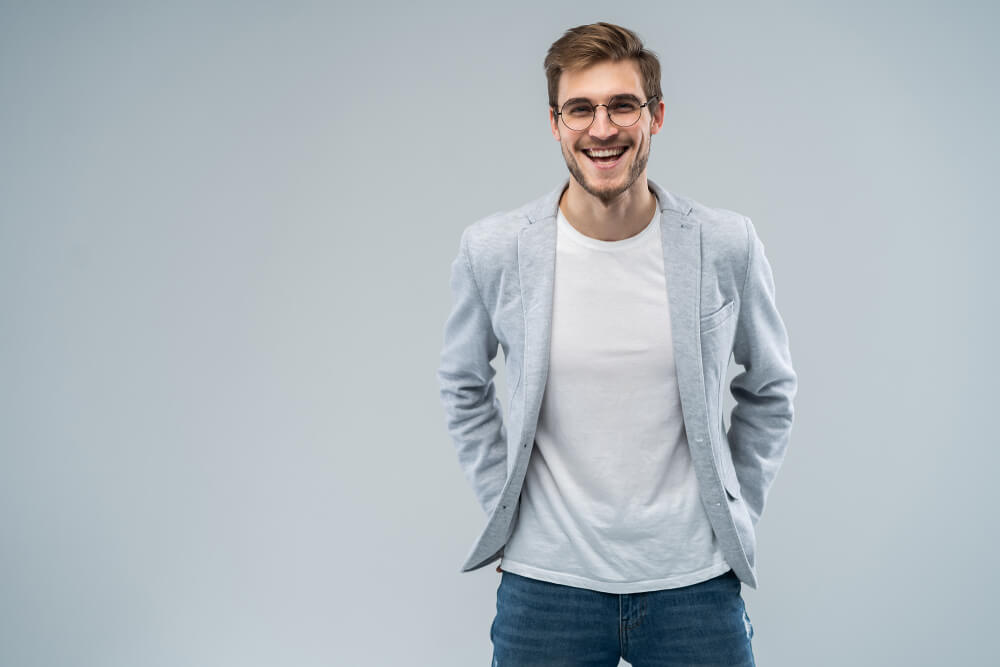 man wearing blazer and jeans