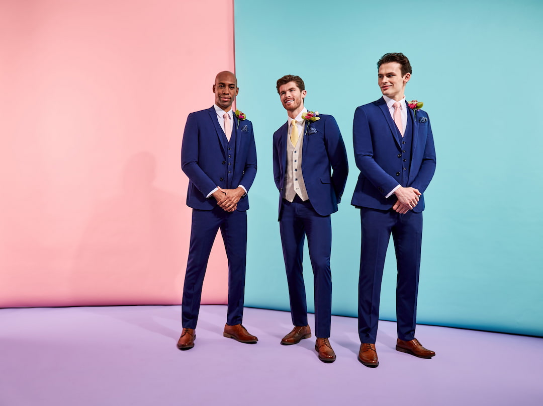 Three men wearing blue suits